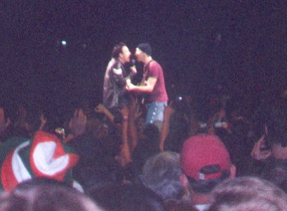 Bono and Edge sing a duet at the tip of the 'heart' in the Fleet Center, 8th June 2001